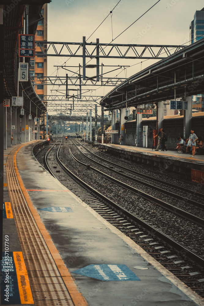 Fototapeta premium Waiting for a train in a train station