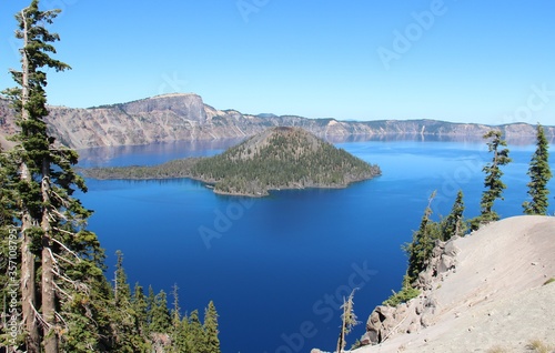 Green island inside the blue lake. Crater Lake