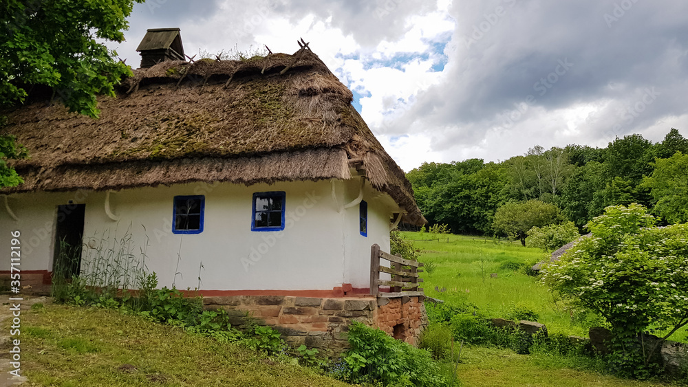 The old house of peasants in the museum Pirogovo. National Museum of Folk Architecture and Everyday Life of Traditional Folklore Houses of Different Regions of Ukraine The old house of peasants in the museum Pirogovo. National Museum of Folk Architecture and Everyday Life of Traditional Folklore Houses of Different Regions of Ukraine