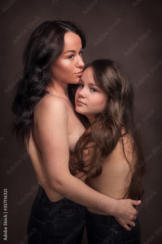 Loving mother and daughter embrace. Family portrait. Loving mother and daughter embrace. Family portrait.