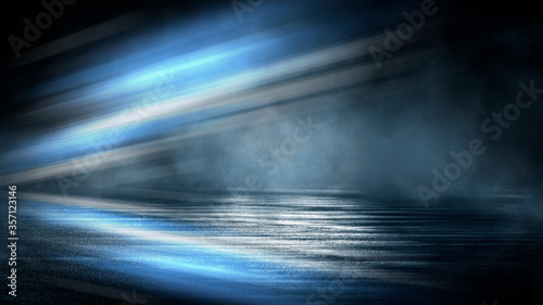 Dark dramatic abstract scene background. Neon glow reflected on the pavement. Smoke  smog and fog. Dark street  wet asphalt  reflections of rays in the water. Abstract dark blue background. 