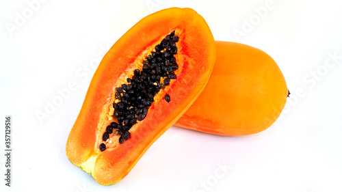 Papaya in half cut and and whole papaya in white background. topical fruit.
