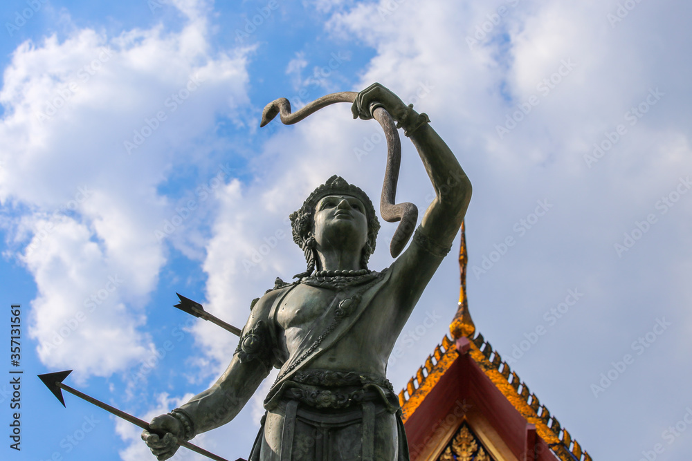 Statue in Bangkok, Thailand of the god Vishnu holding the bow Sharing Statue in Bangkok, Thailand of the god Vishnu holding the bow Sharing