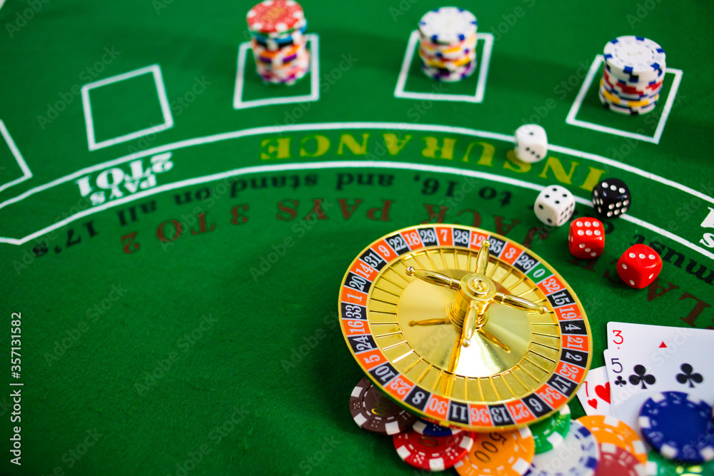 Casino equipment placed on the green floor for risky gambling for the people who want to get rich. Casino equipment placed on the green floor for risky gambling for the people who want to get rich.