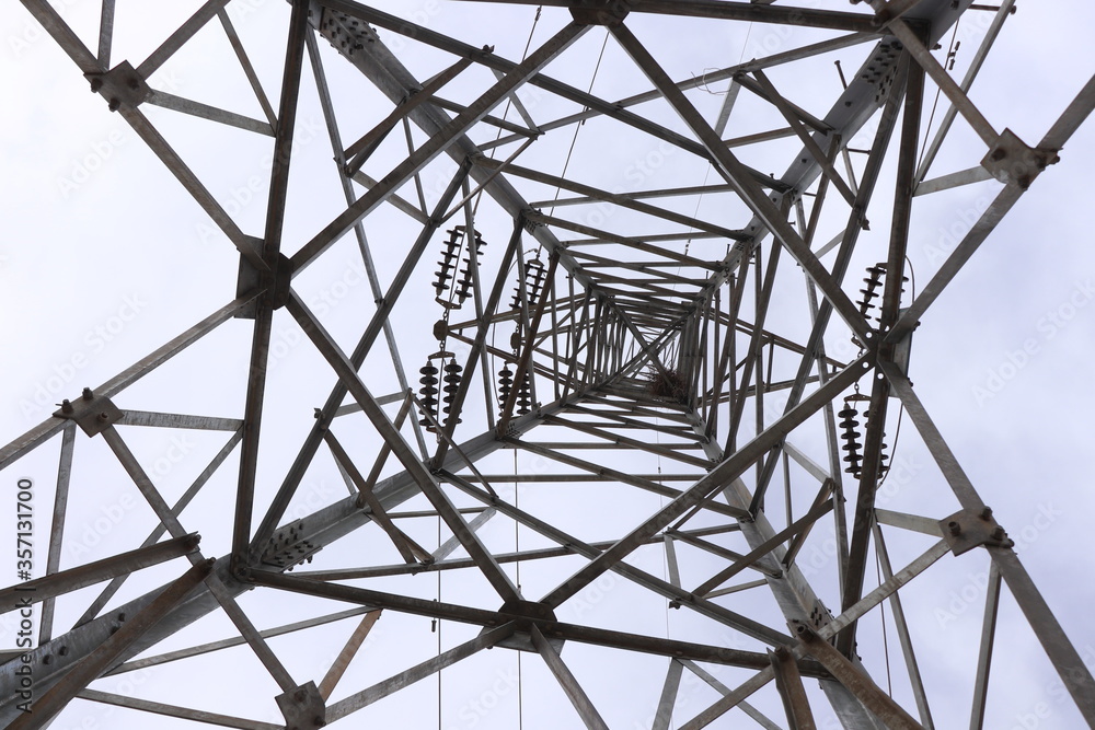 A utility pole is a column or post used to support overhead power lines and various other public utilities, such as electrical cable, fiber optic cable, and related equipment such as transformers .