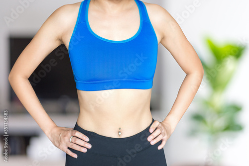 Young woman wearing blue sport bra