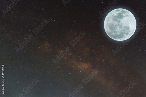 Fototapeta Naklejka Na Ścianę i Meble -  Full moon and milky way on the sky.