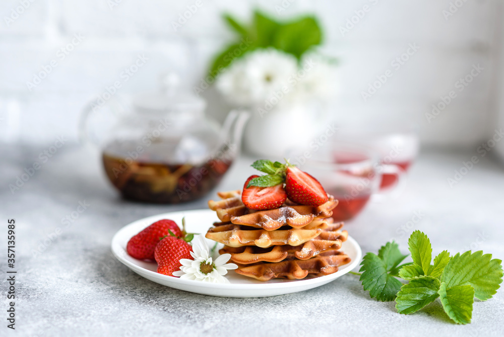 Delicious fresh baked belgian waffles with berries and fruit