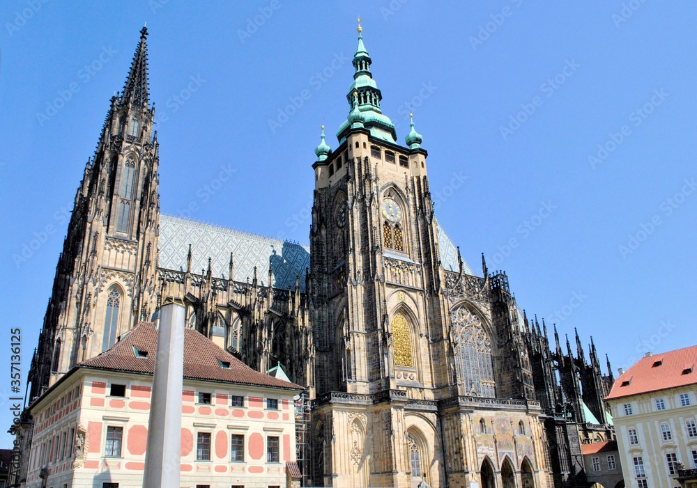 Old gothic architecture house historical landmark Prague Czech republic city Europe tour blue sky windows background