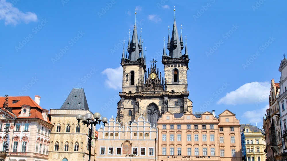 Prague town Europe Czech republic gothic architecture cityscape old walls antique watches blue sky background
