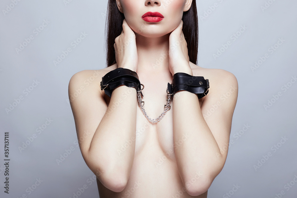 perfect Body Naked Girl in handcuffs. slave Woman - obrazy, fototapety, plakaty 