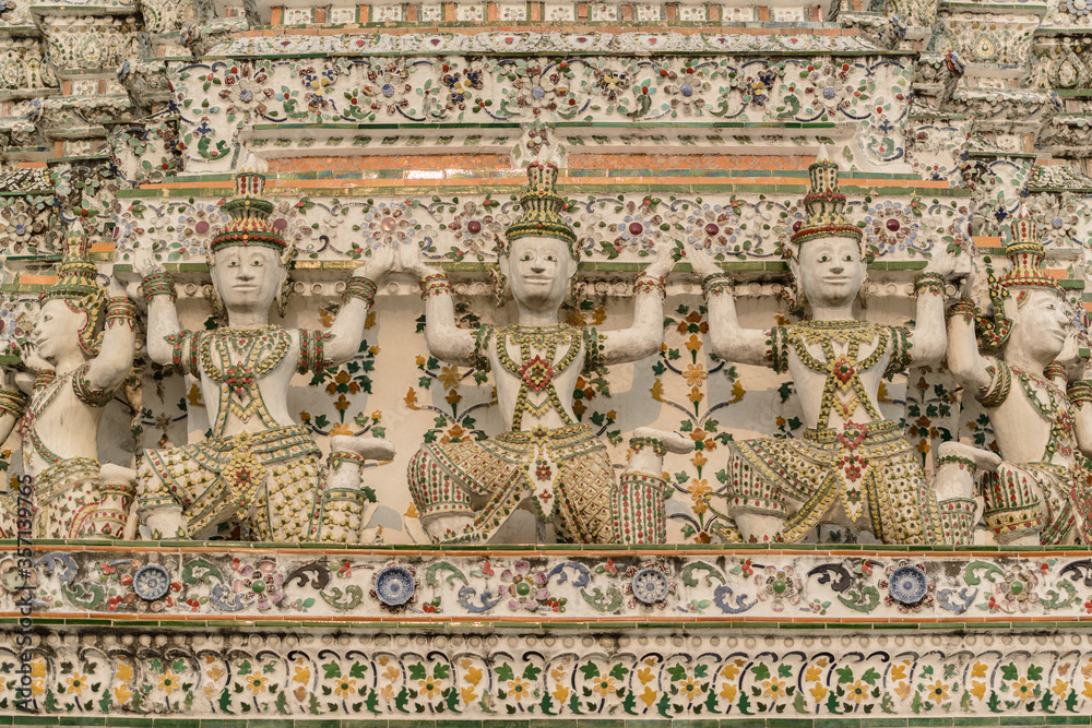 Angel statues carrying the base of Mondop, Wat Arun, Bangkok, Thailand.