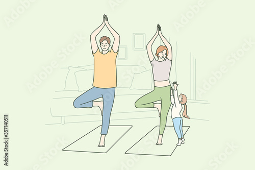 Family, yoga, sport, recreation concept. Man dad and woman mom do morning yoga practice exercise at home while child kid daughter seeking attention. Active lifestyle healthcare or fathers mothers day.