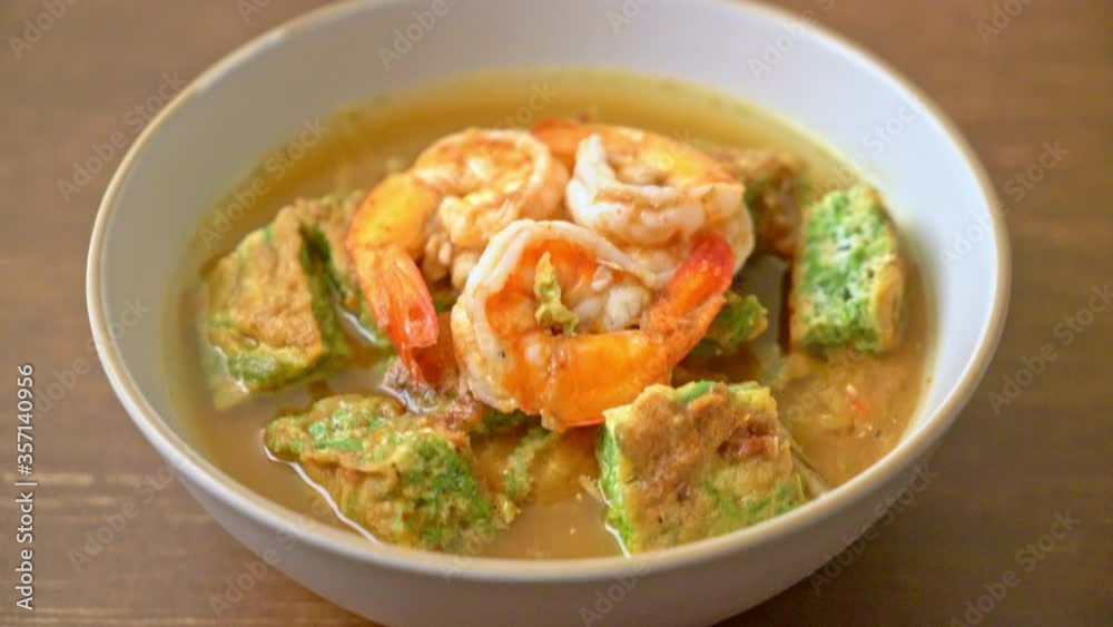 Sour soup made of Tamarind Paste with Shrimps and Vegetable Omelet - Asian food style Sour soup made of Tamarind Paste with Shrimps and Vegetable Omelet - Asian food style