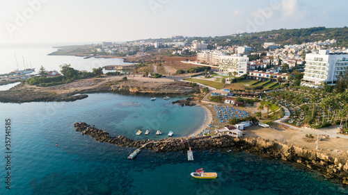 Aerial bird's eye view of Green bay Protaras, Paralimni, Famagusta, Cyprus. Famous tourist attraction diving location rock beach with boats, sea restaurant, water sports on summer holidays, from above © f8grapher