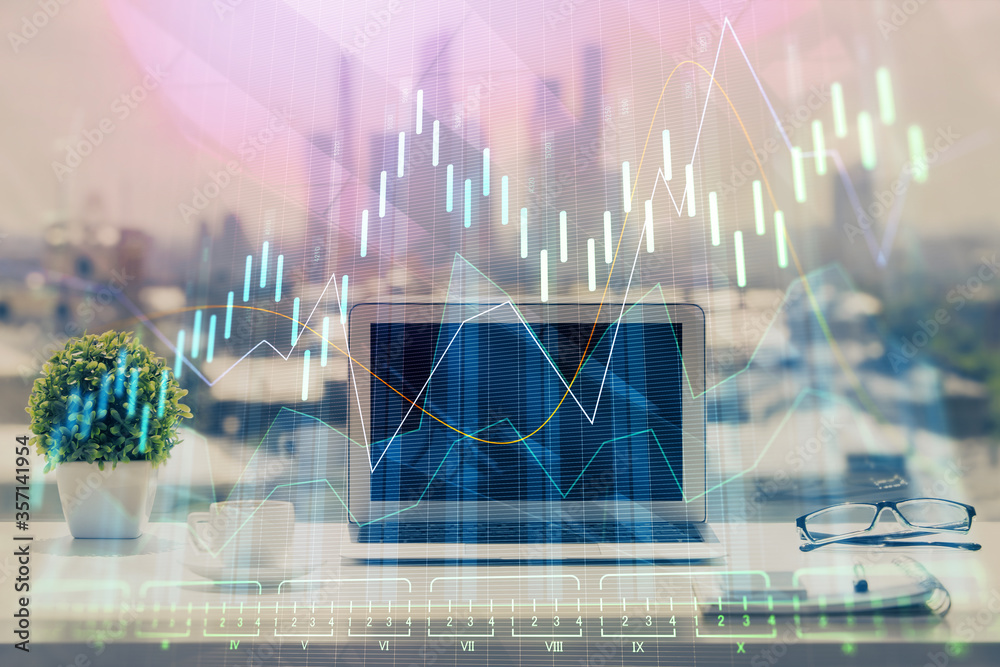 Financial chart drawing and table with computer on background. Double exposure. Concept of international markets. Financial chart drawing and table with computer on background. Double exposure. Concept of international markets.