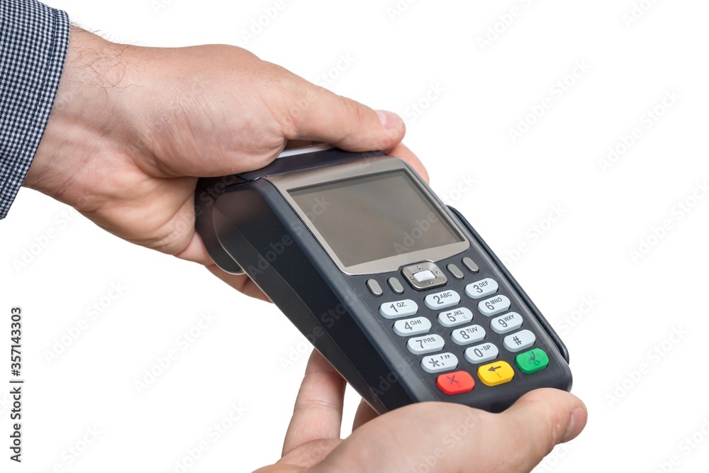 Payment terminal in hand of man isolated on white Payment terminal in hand of man isolated on white