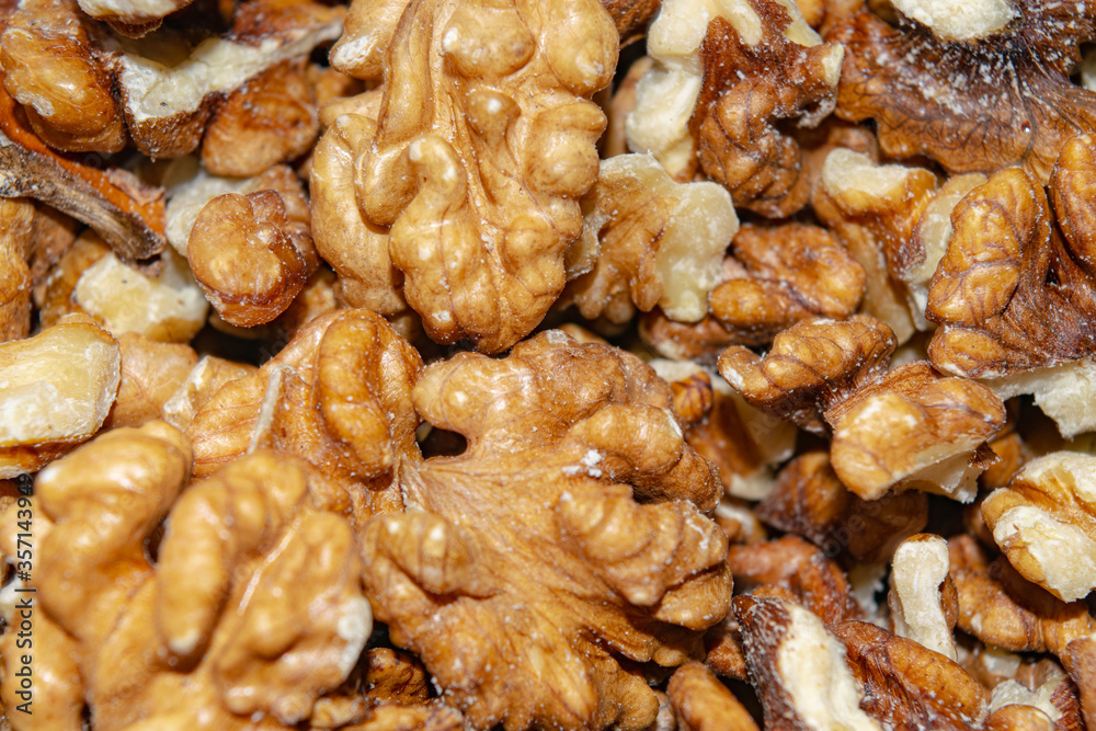 Peeled walnuts close-up. Surface texture. Healthy diet. Peeled walnuts close-up. Surface texture. Healthy diet.
