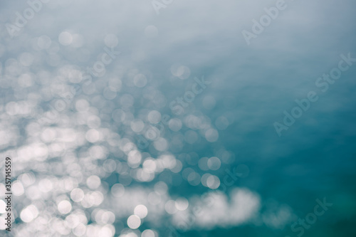 Abstract panoramic bokeh background from summer blue sea water.