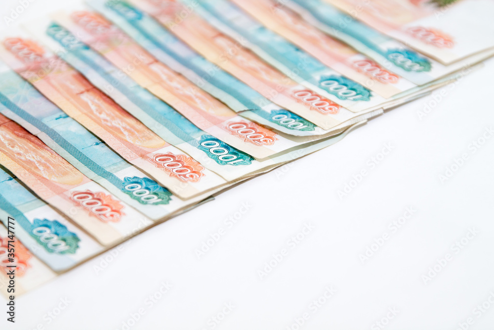 Copy space with Russian money banknotes rows of five thousand and one thousand rubles on white backround Copy space with Russian money banknotes rows of five thousand and one thousand rubles on white backround