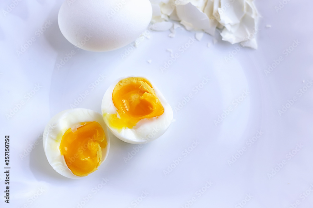 boiled egg peeled and divided into two halves boiled egg peeled and divided into two halves