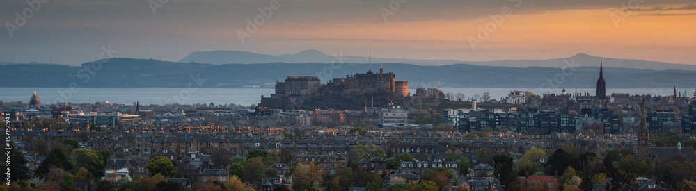 gorgeous sightseeing panorama view of Edinburgh City during sunrise, with glory sunlight shines upon Edinburgh Castle