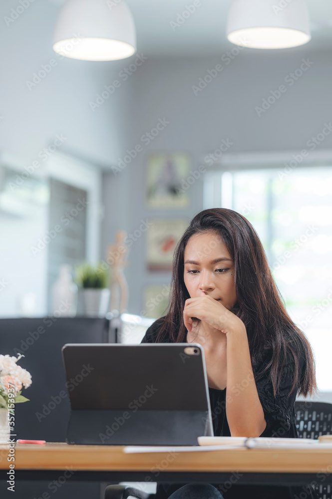 Concentrated young businesswoman working on her computer. Concentrated young businesswoman working on her computer.