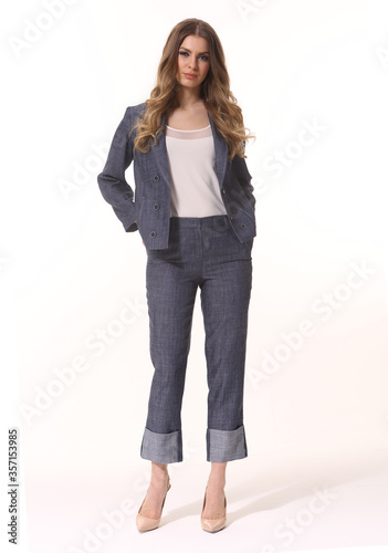 business woman executive posing in denim jeans suit jacket and trousers