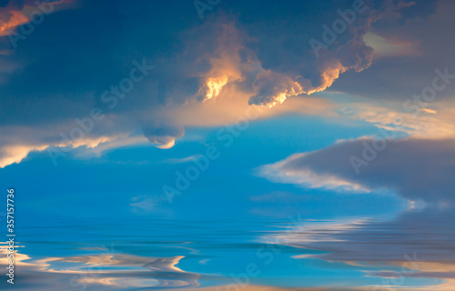Beautiful Cumulus clouds over the sea at sunset. Natural composition.