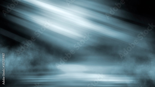 Dark dramatic abstract scene background. Neon glow reflected on the pavement. Smoke, smog and fog. Dark street, wet asphalt, reflections of rays in the water. Abstract dark blue background.  © MiaStendal