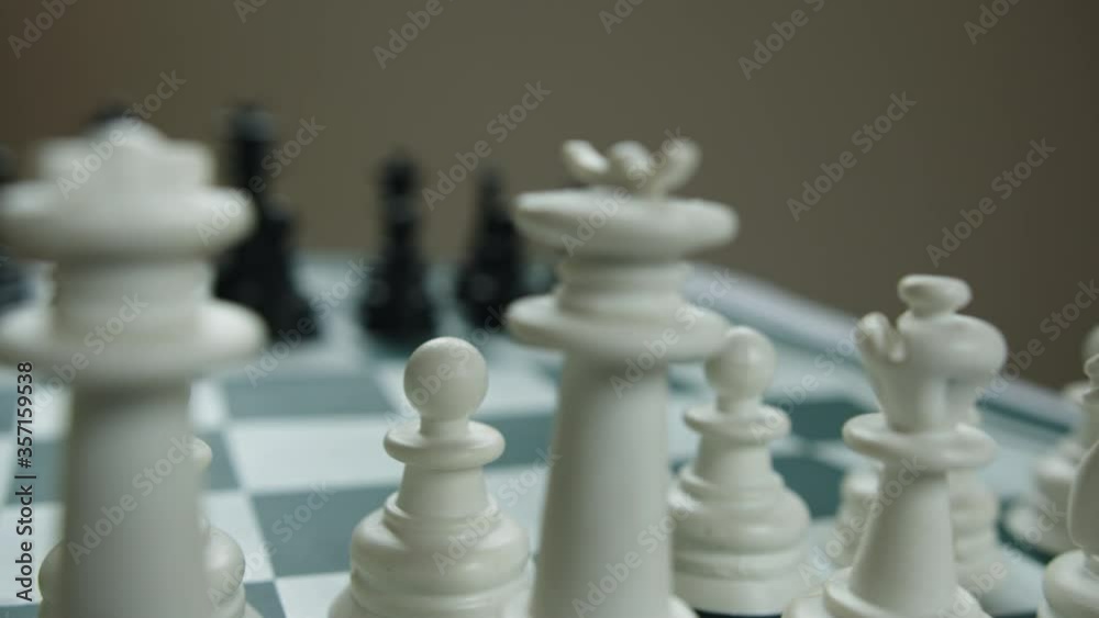Black and white chess pieces on the chess board close-up