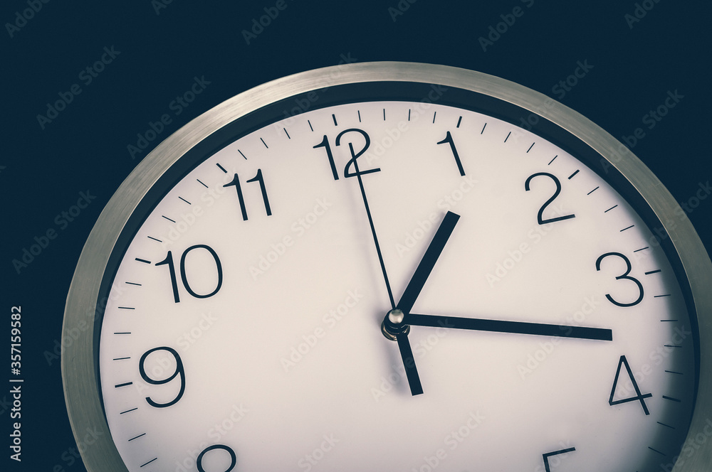 Close-up view of clock - deadline and time concept Close-up view of clock - deadline and time concept