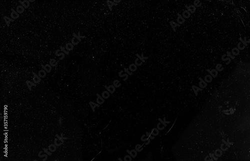 Grunge texture filter. Old film effect. White grain dust scratches on black background.