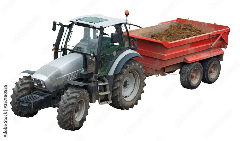 Obraz premium Heavy tractor pulling a trailer loaded with dirt from a construction site. Isolated on white.