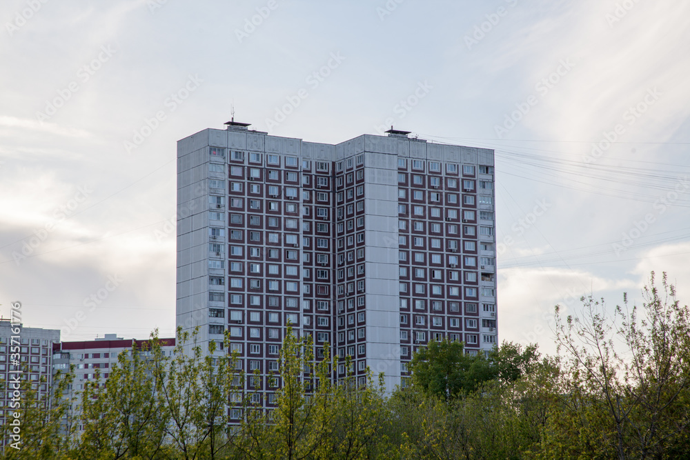 Residential building in the style of architecture of the USSR, facade and windows of a residential building