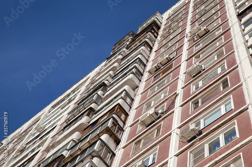 Residential building in the style of architecture of the USSR, facade and windows of a residential building