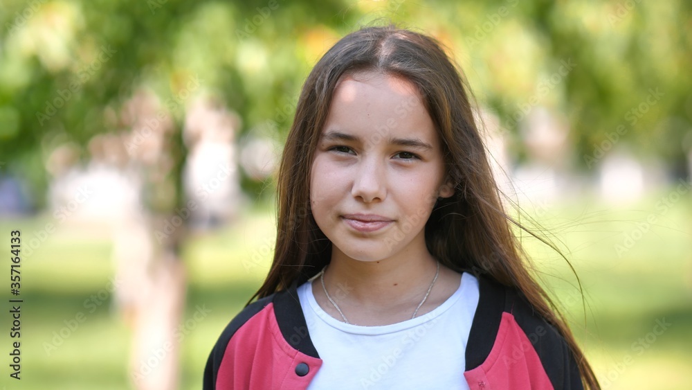 Portrait of a smiling 11 year old girl with long hair. Portrait of a smiling 11 year old girl with long hair.