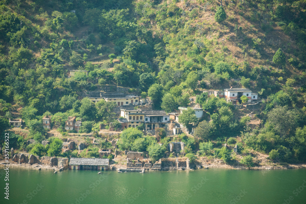 An abandoned village submerged from the water of Tehri hydropower dam, Uttarakhand India