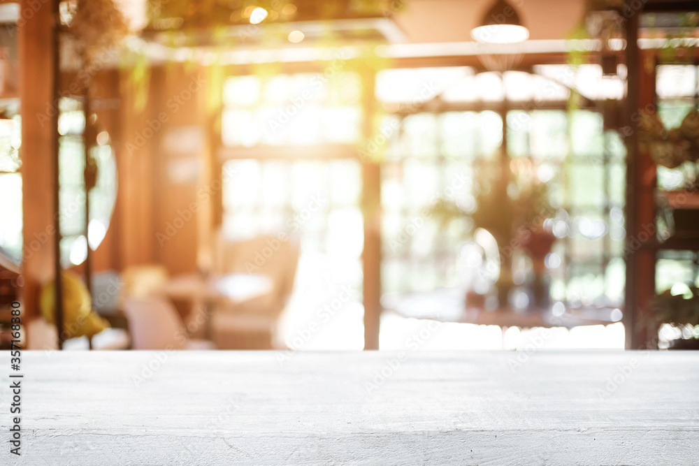 Empty wooden table space platform and blurred restaurant or coffee shop background for product display montage.