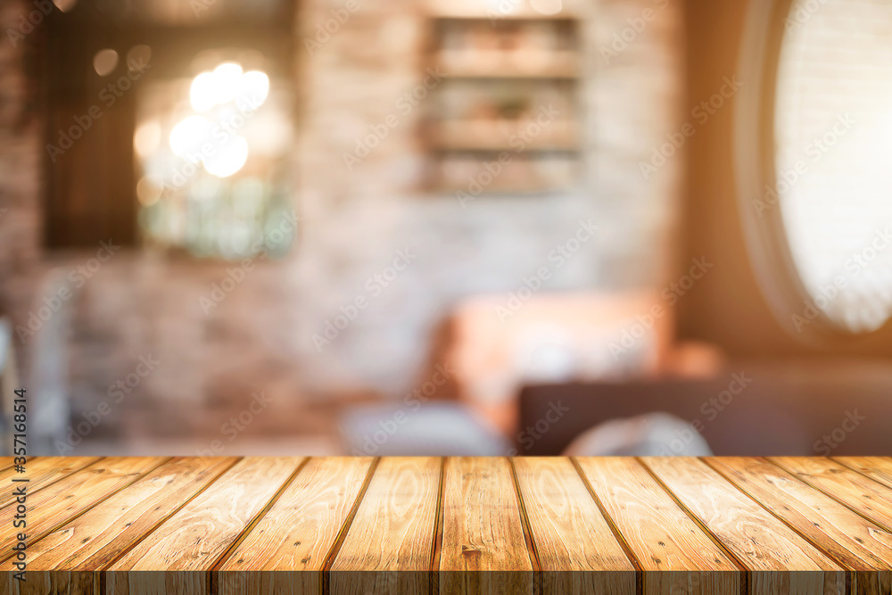 Empty wooden desk space platform and blurred resturant or coffee shop background for product display montage.