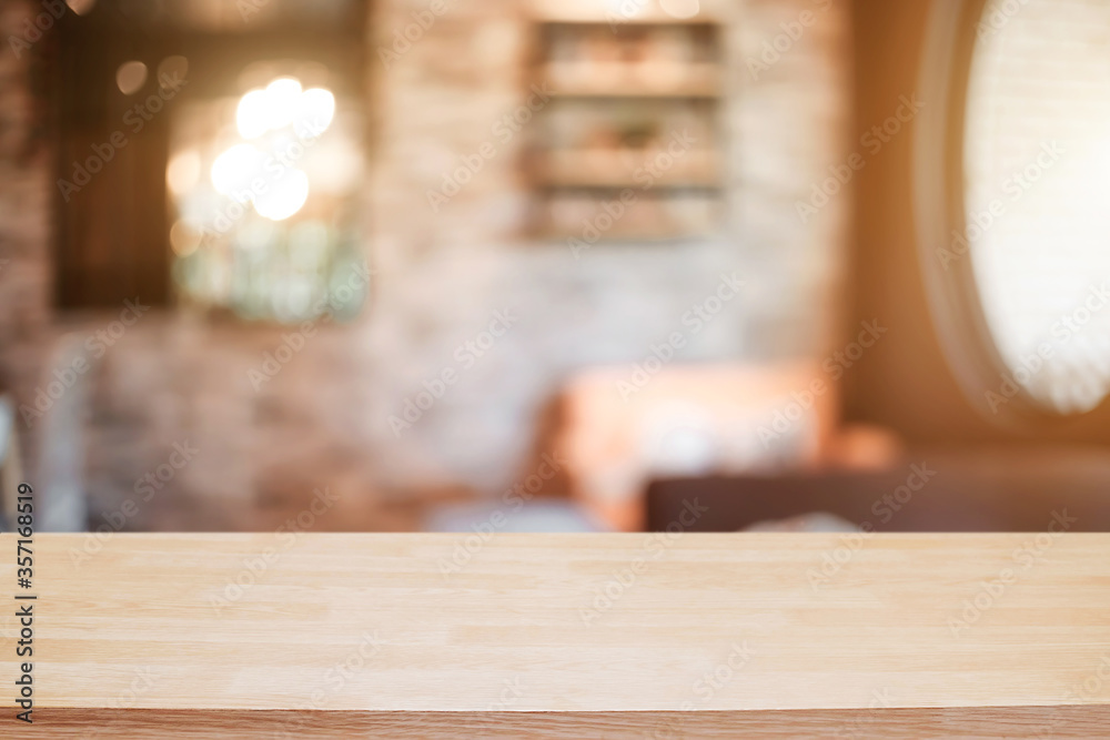 Empty wooden desk space platform and blurred resturant or coffee shop background for product display montage. Empty wooden desk space platform and blurred resturant or coffee shop background for product display montage.
