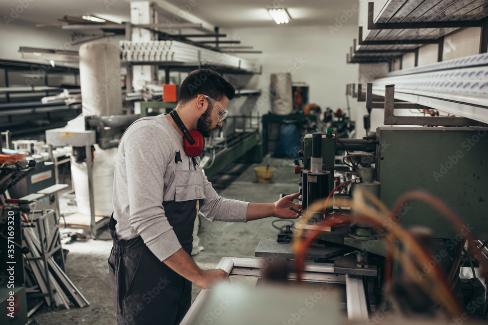 PVC industry worker making PVC frames for windows and doors