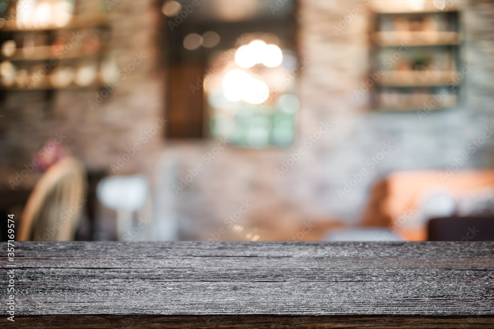 Empty wooden table space platform and blurred resturant or coffee shop background for product display montage. Empty wooden table space platform and blurred resturant or coffee shop background for product display montage.