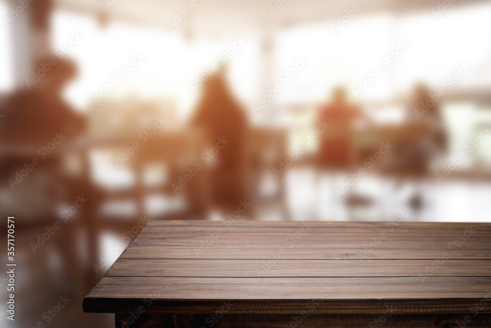 Empty wooden table space platform and blurred resturant or coffee shop background for product display montage. Empty wooden table space platform and blurred resturant or coffee shop background for product display montage.