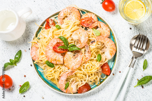 Pasta seafood with shrimp on white table.