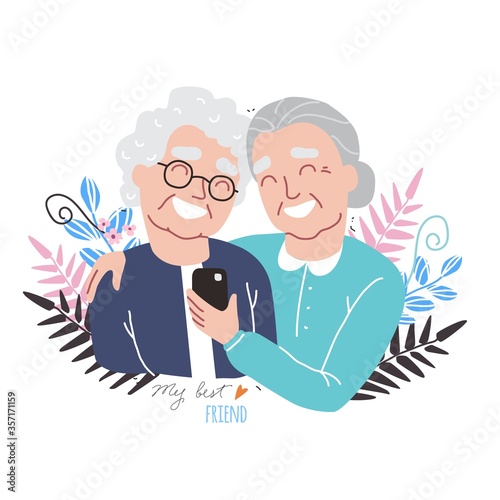 Portrait of smiling old womens. Happy friends holding each other. Happy friendship day. Old people with smartphone