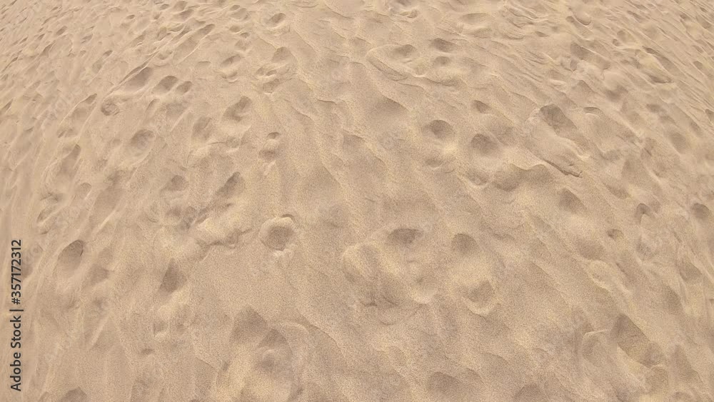 textured golden sand with traces at sunny day, Gran Canaria, Spain textured golden sand with traces at sunny day, Gran Canaria, Spain