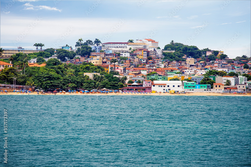 Salvador, Brazil, a view of the city from the sea. City beach.
 The small but beautiful beach of Porto da Barra is surrounded by reefs that protect it from the waves and provide a relaxing holiday.
