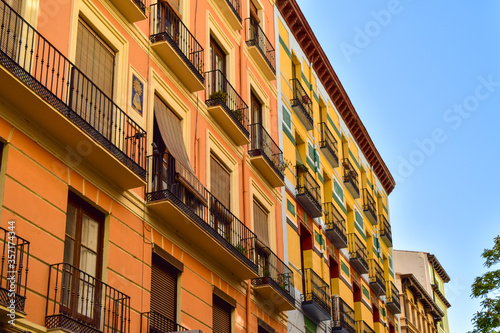 Quadro su tela Colorful traditional houses of the 19th century on Torre Nueva street in Saragos