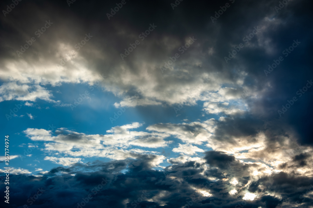 Natural sky composition. Dark ominous colorful storm rain clouds. Dramatic sky. Overcast stormy cloudscape. Thunderstorm. Element of apocalypse design. Toned.